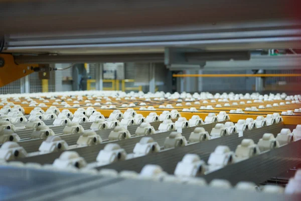 An empty industrial roller conveyor belt in a fully automated factory. roller conveyor to easily move heavy industrial goods around without the need for humans.future of industrial manufacture.