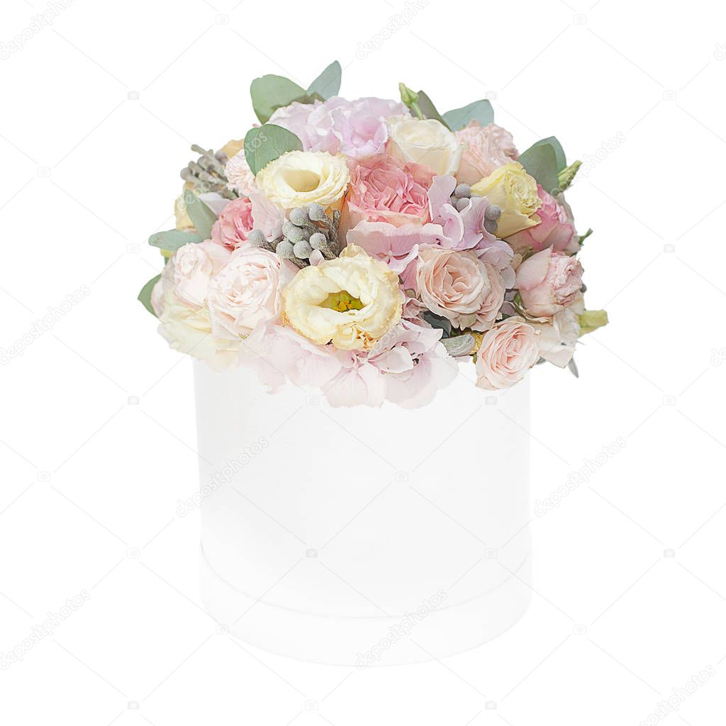 Bouquet of gentle flowers in the box isolated on white background