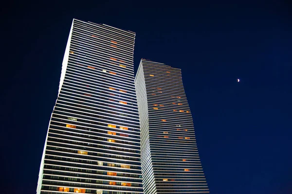 Bottom night view of  modern business center, office buildings skyscrapers in Astana city, Kazakhstan.