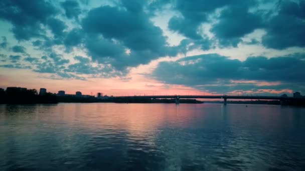 Aerial 4k view. Stunning sunset sun over the river. Flying above the surface of the water — Stockvideo