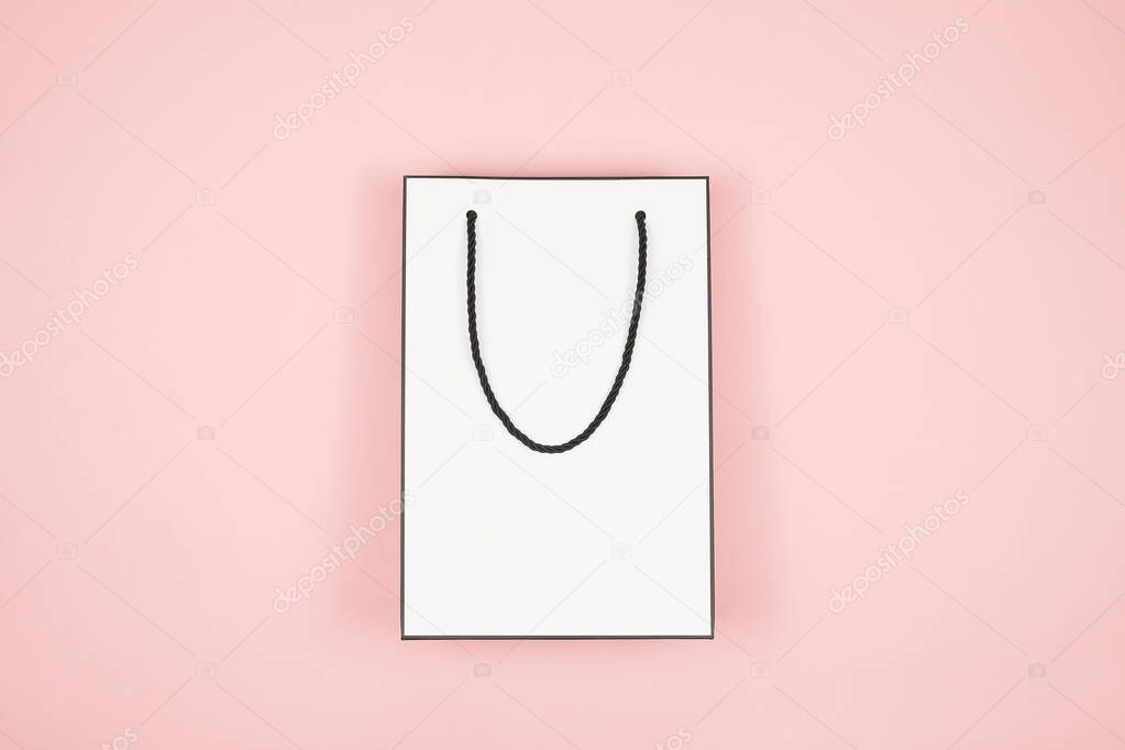 Banner ,flyer or poster mock up for Mothers Day sale, white shopping bag on pink background. A paper bag for shopping with red hearts. Valentines Day, Happy Womens day.