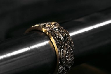  Close-up of diamond on the ring. Craft jewelery making with professional tools. 