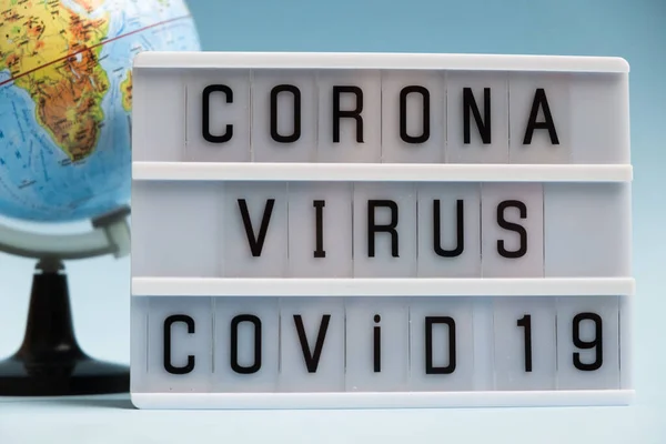 Corona Virus Concept. Coronavirus outbreak. World pandemia. Novel coronavirus 2019-nCoV with text on blue background.