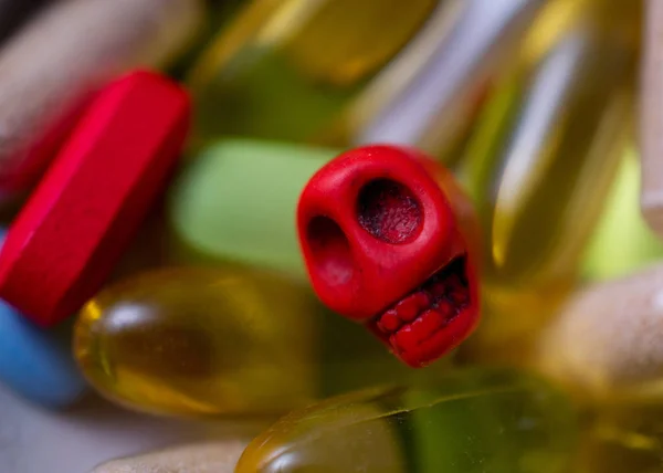 Mini-skull surrounded by pills