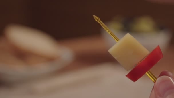 Canape with cheese, olive and sweet pepper. — Stock Video