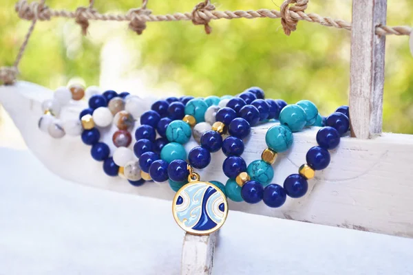 Blue agate gemstone bracelets - greek jewelry with evil eye — Stock Photo, Image