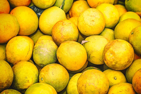 Orange crop harvest in brazil on winter in a cloudy day