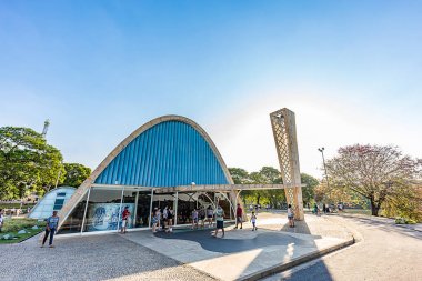 BELO HORIZONTE, BRAZIL - 14, OCTOBER, 2017: An exterior view of the church of Saint Francis of Assis. Designed by Oscar Niemeyer, AKA The Pampulha Church, Minas Gerais, Brazil. clipart