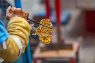 Pocos de Caldas, Minas Gerias/Brazil. Man shapping a crystal glass