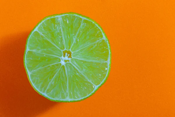 stock image Fresh lemon isolated on orange background, top view, concept photo