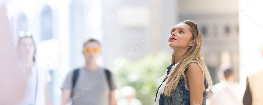 Beautiful teenager girl looking up, close up photo with defocuse