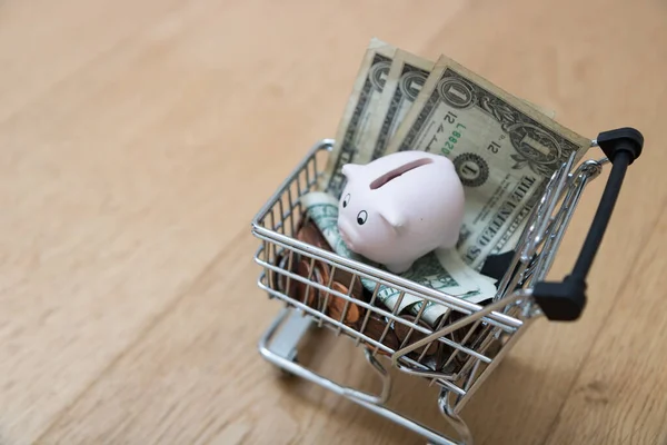 Happy Piggy Bank Shopping Cart Full Dollars — ストック写真