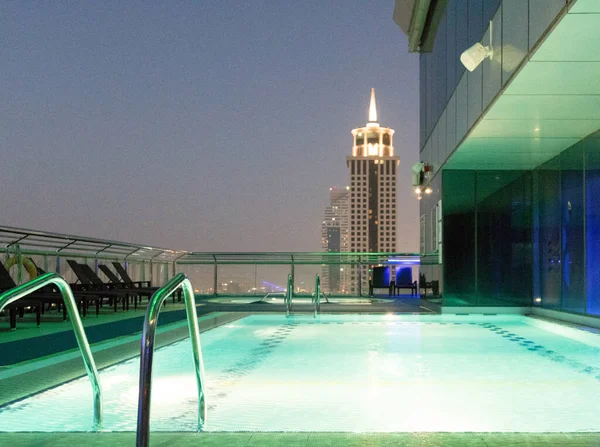 Rooftop swimming pool by night