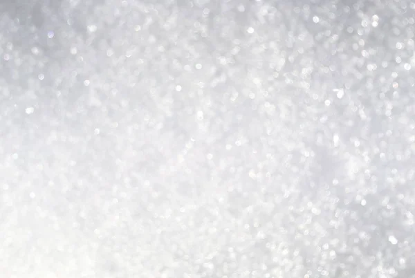 Zilver glitter bokeh van verse sneeuw abstracte textuur achtergrond — Stockfoto