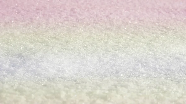 白い雪のテクスチャ背景からパステル カラーのキラキラ ボケ — ストック写真