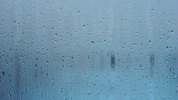 蓝色的水，从雨降纹理背景 — 图库照片