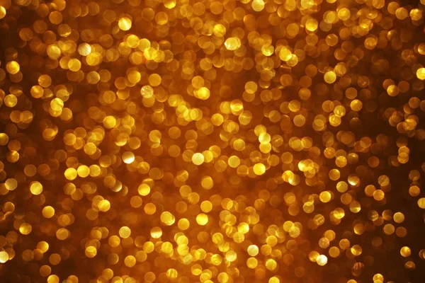 Oro lucido offuscata bokeh sfondo astratto — Foto Stock