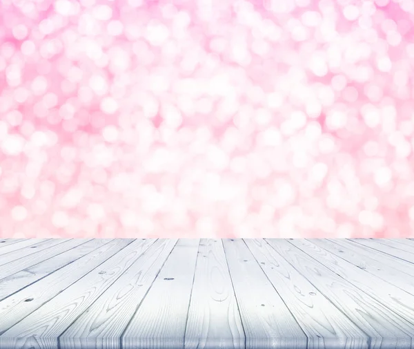 Houten tafelblad op wazig van witte en roze bokeh achtergrond — Stockfoto