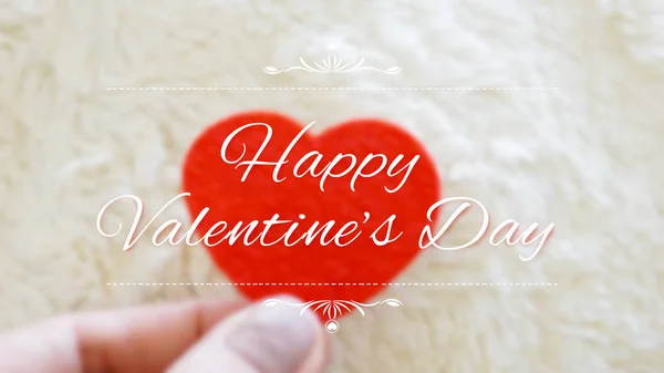 Holding red heart blurred background with words Happy Valentine' — Stock fotografie