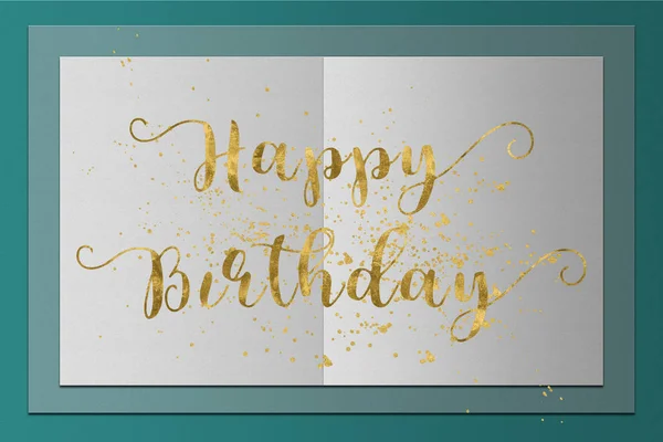 Happy Birthday card gold words on paper background — Stock Photo, Image