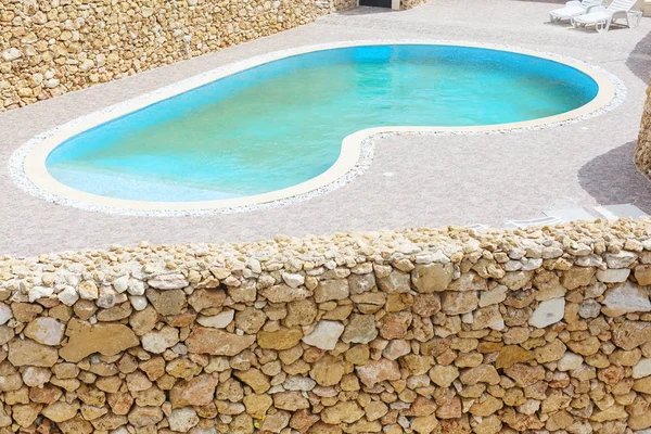 Swimming Pool Behind Stone Wall — Stock Photo, Image