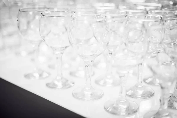 Transparent glasses in a row — Stock Photo, Image