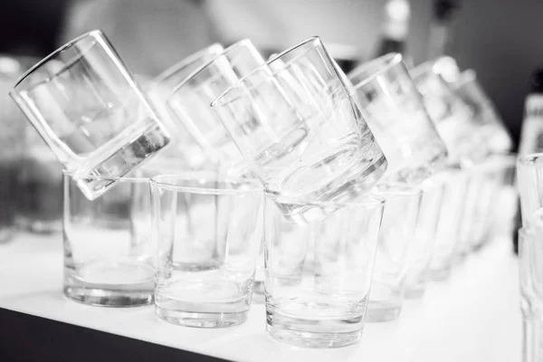 Transparent glasses in a row — Stock Photo, Image