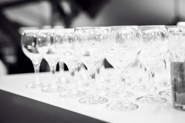 Transparent glasses in a row — Stock Photo, Image