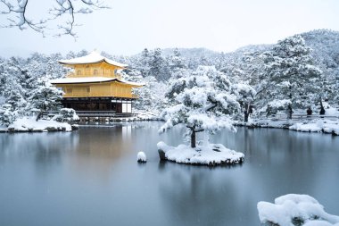 Kinkakuji temple and snow landscape,Kyoto,tourism of Japan clipart