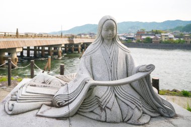 Murasakishikibu statue at Uji river,kyoto,tourism of japan clipart