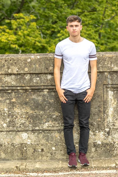 stock image Teenage boy in a park on a warm summers day