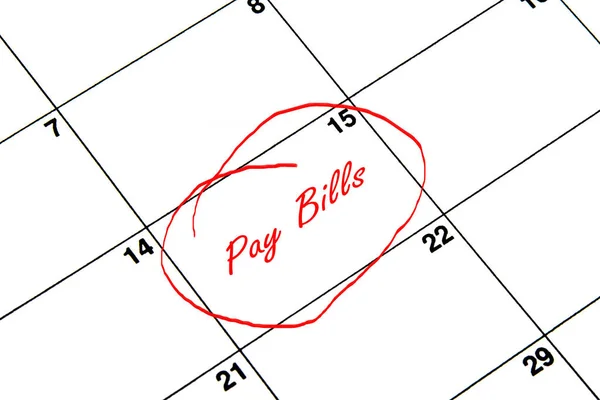 Pay Bills Circled on A Calendar in Red