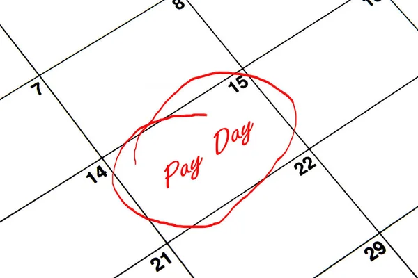 Pay Day Circled on A Calendar in Red