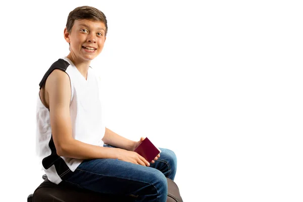 Young teenage boy isolated on white with a suitcase and passport — Stock Photo, Image