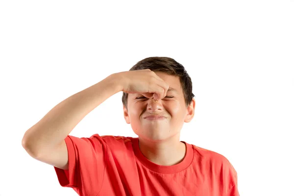 A young teenage boy isolated against white background with a migraine — Stock Photo, Image