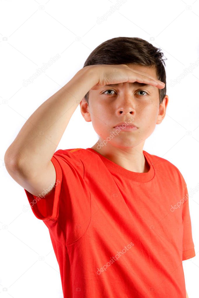 Young teenage boy isolated on white shielding his eyes
