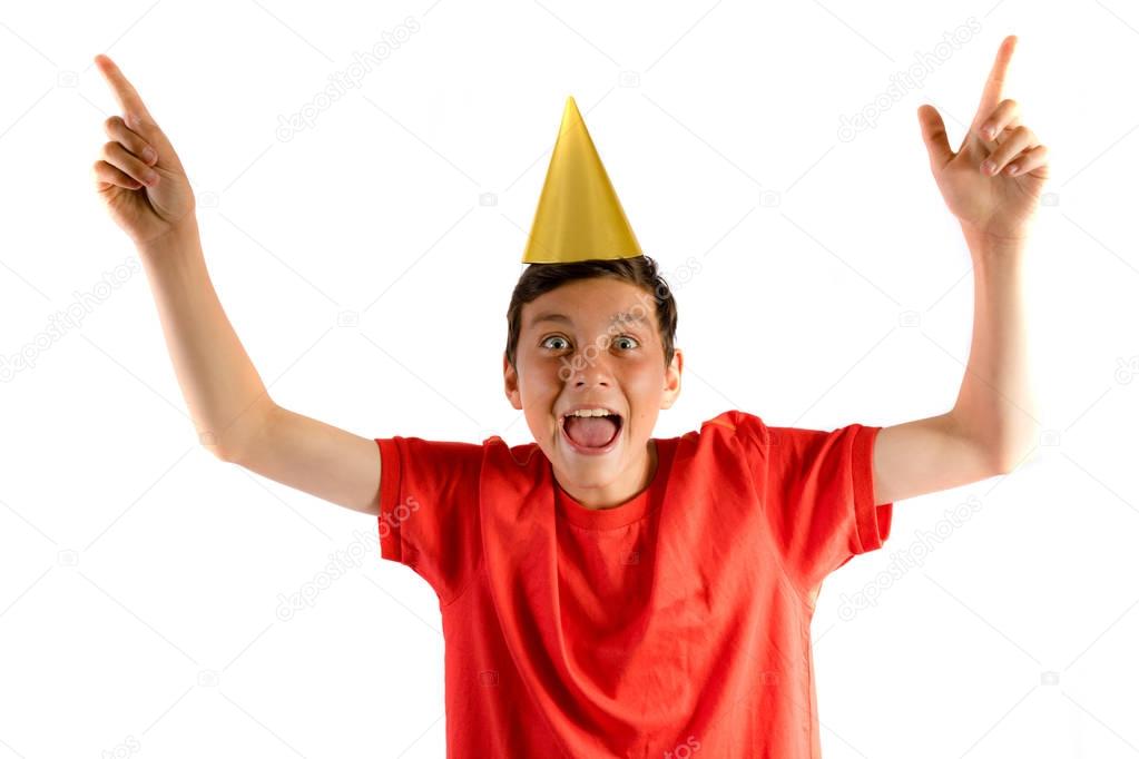 Young teenage boy isolated on white celebrating at a party