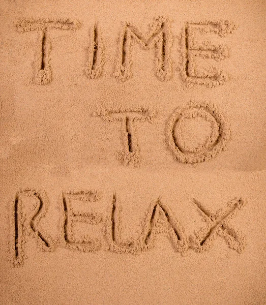 Time to relax written in soft wet sand on a beach — Stock Photo, Image