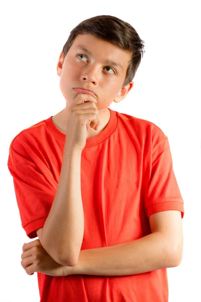 Young teenage boy isolated on white thinking — Stock Photo, Image