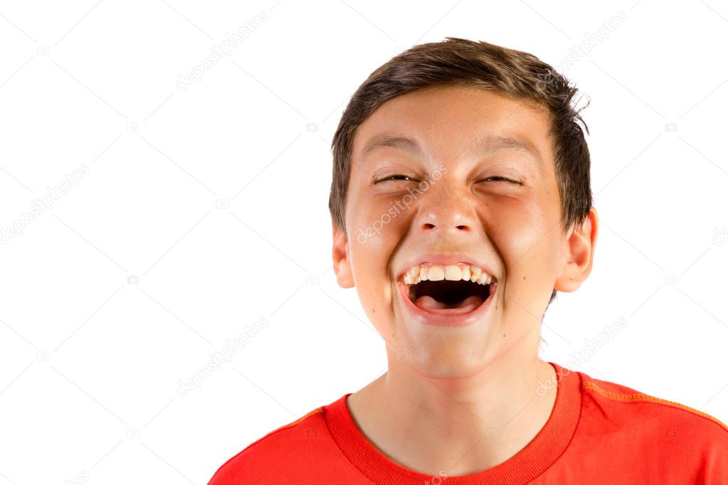 Young teenage boy isolated on white roaring with laughter
