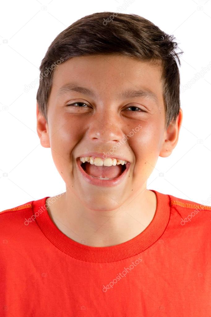 Young teenage boy isolated on white roaring with laughter