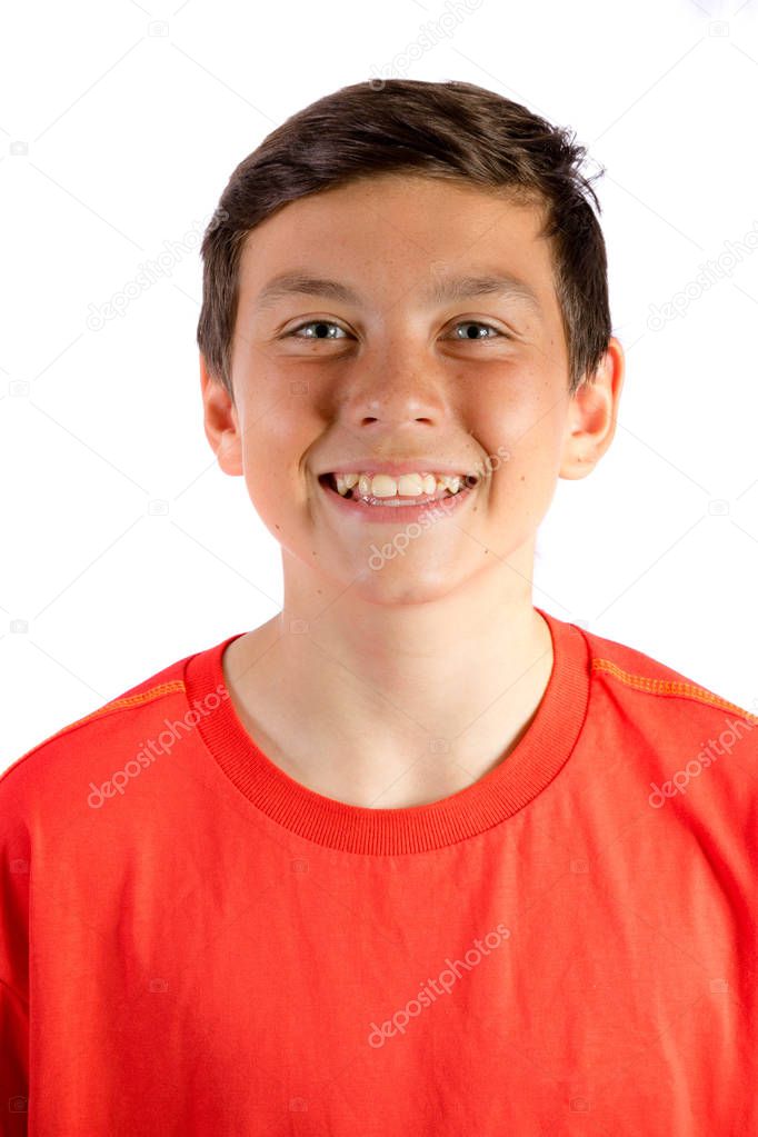 Young teenage boy isolated on white smiling