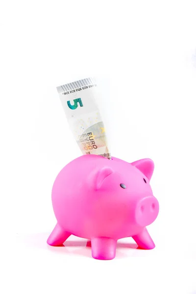 Piggy bank with five euro note — Stock Photo, Image