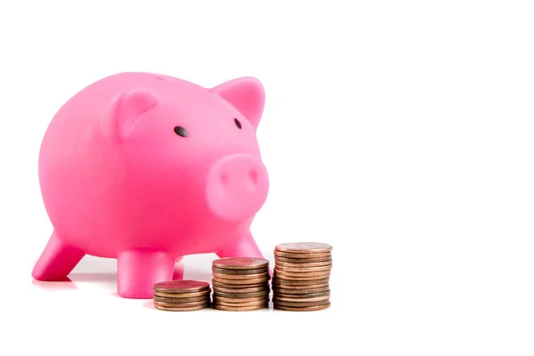 Piggy bank with pile of coins — Stock Photo, Image