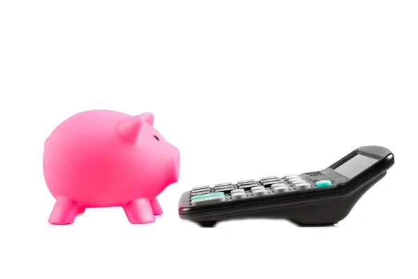 Piggy bank with a calculator — Stock Photo, Image