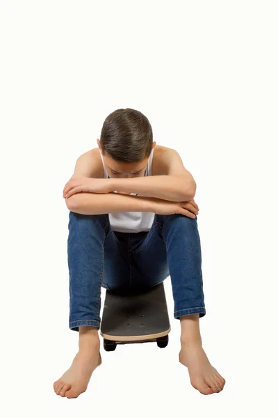 Young teenage caucasian boy with his skateboard — Stock Photo, Image