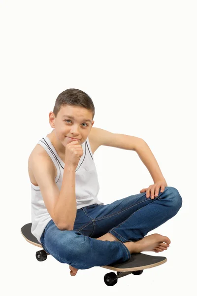 Young teenage caucasian boy with his skateboard — Stock Photo, Image