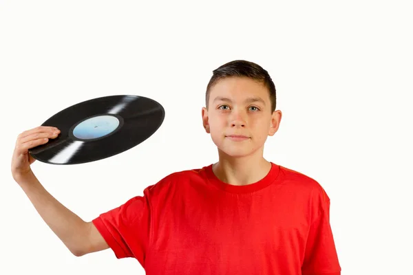 Jovem caucasiano adolescente menino segurando um vinil lp — Fotografia de Stock