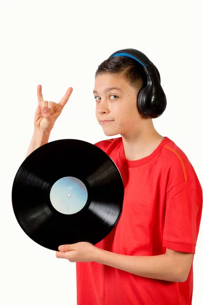 Young caucasian teenage boy holding a vinyl lp — Stock Photo, Image