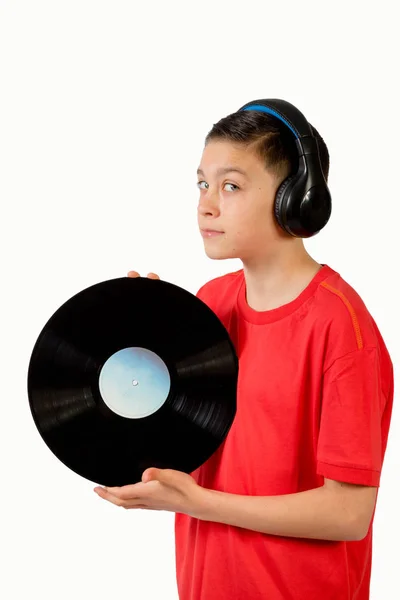 Jovem caucasiano adolescente menino segurando um vinil lp — Fotografia de Stock